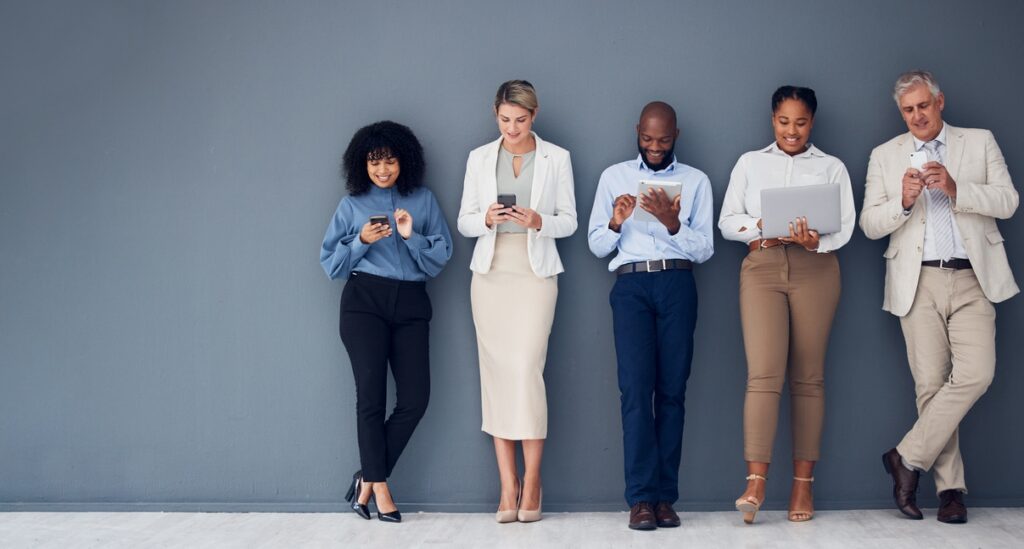 mockup, wall and business people with technology, recruitment and waiting for job interview. diversity, men and women with devices, employees and collaboration for cyber security and data analytics