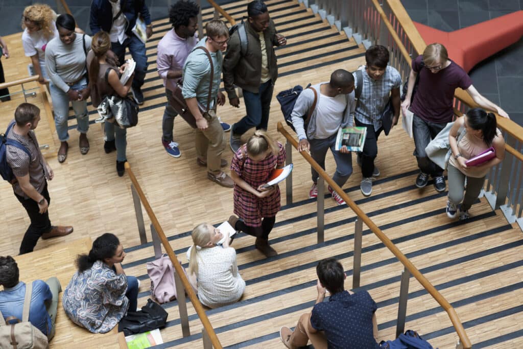 elevated view of university students walking up and down stairs