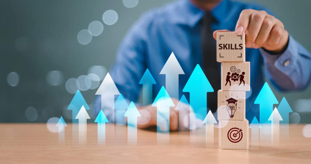 skill competency development concept. up new ability skill training for technology evolution. leadership thinking upskill. hand hold wooden cube, soft skill digital icon. education learning talent